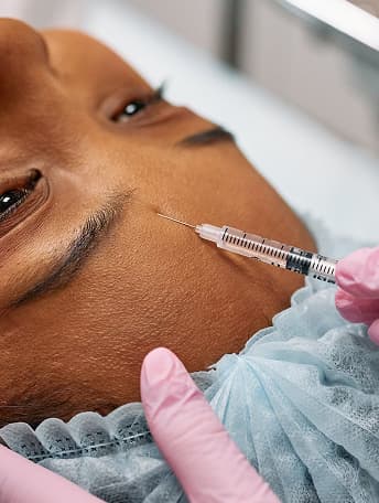 injection  on woman's face